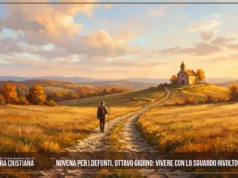 Novena per i defunti, ottavo giorno: vivere con lo sguardo rivolto all’eternità Pellegrino con bastone cammina su una strada di pietra tra campi dorati d'autunno diretto a una chiesetta al tramonto.